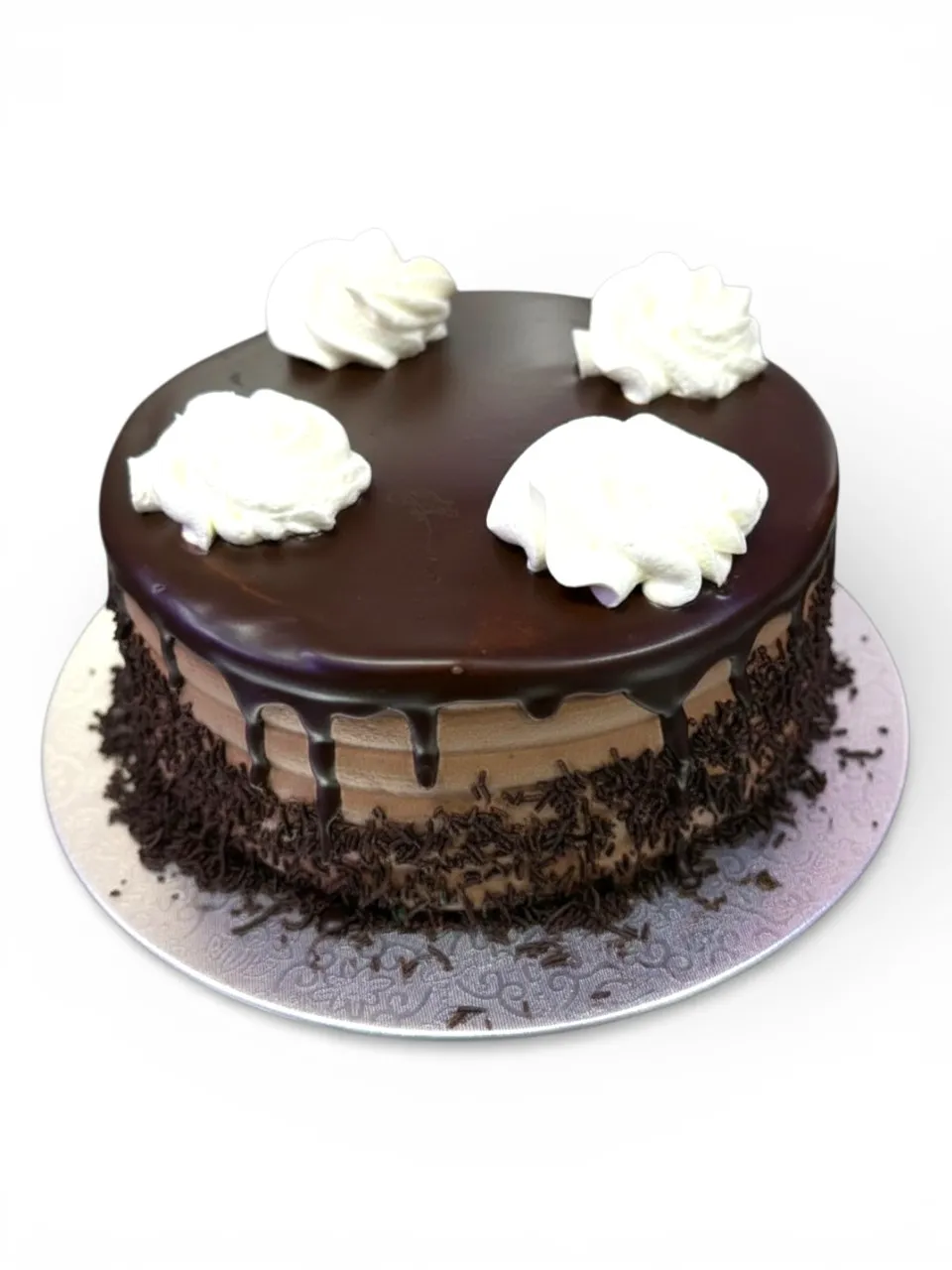 A dense, rich Chocolate eggless cake from Num Num's Bakery, showing the moist crumb a properly balanced egg-free chocolate recipe should have