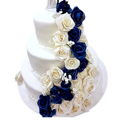 A three-tier wedding cake with sugar roses